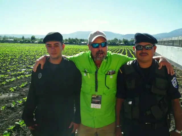 three men at a field