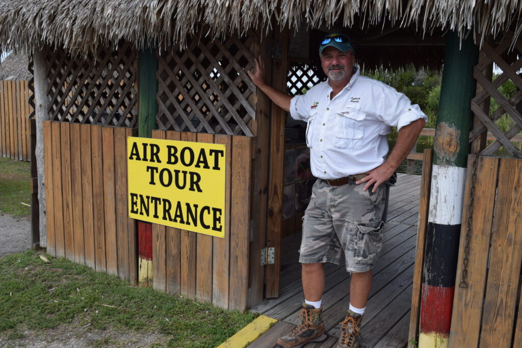 Captain Randy standing next to Private Airboat Entrance door for Florida Everglades adventure